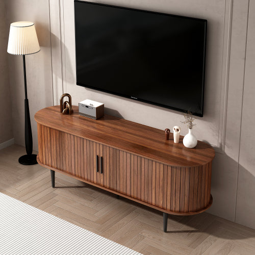 Aveley TV console in walnut with sliding door, in a living room