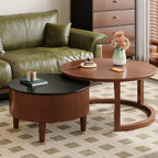 Delvaux round coffee table in a seating group beside a sofa