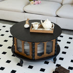 Tarn round storage coffee table in black, in a living room