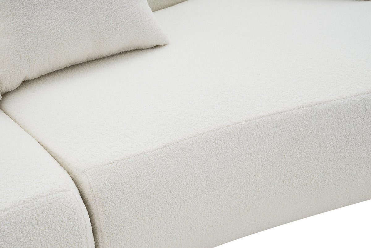 Solene Curved Sofa in a living room
