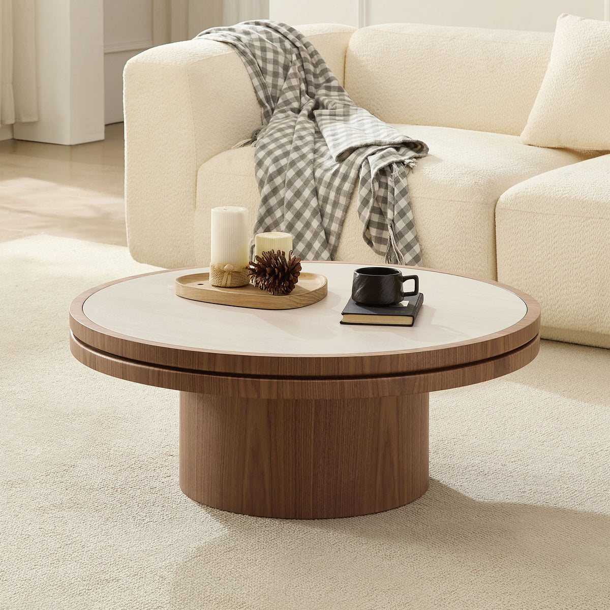 Eldin square coffee table in walnut on a pedestal base, in a living room