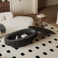 Turin oval coffee table in black, styled in a living room