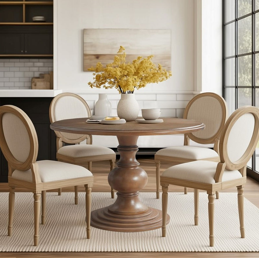 Wetherby round pedestal dining table in a dining room