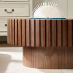 Fjord drum coffee table styled beside a sofa