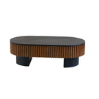 Riva elliptical coffee table in black, in a living room