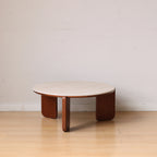 Linden round coffee table in brown, in a living room