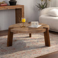 Perrin coffee table in natural wood, in a living room