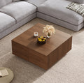 Bellac four-drawer coffee table in walnut, in a living room