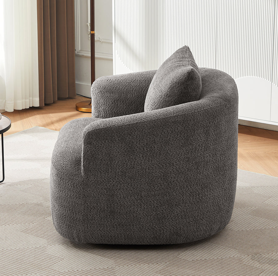 Bibury bouclé chair with throw pillow